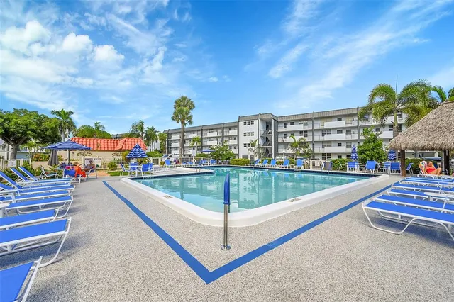 a view of swimming pool from a balcony