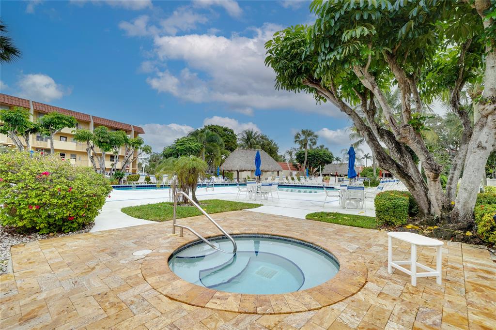 777 South Federal Highway, Unit M301 Pompano Beach, FL 33062 - Photo 15 of 16 a view of a swimming pool with a patio