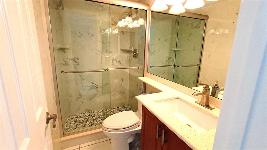 777 South Federal Highway, Unit M301 Pompano Beach, FL 33062 - Photo 9 of 16 a bathroom with a sink toilet and shower