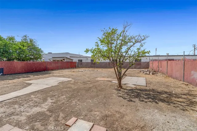 a house view with a backyard space