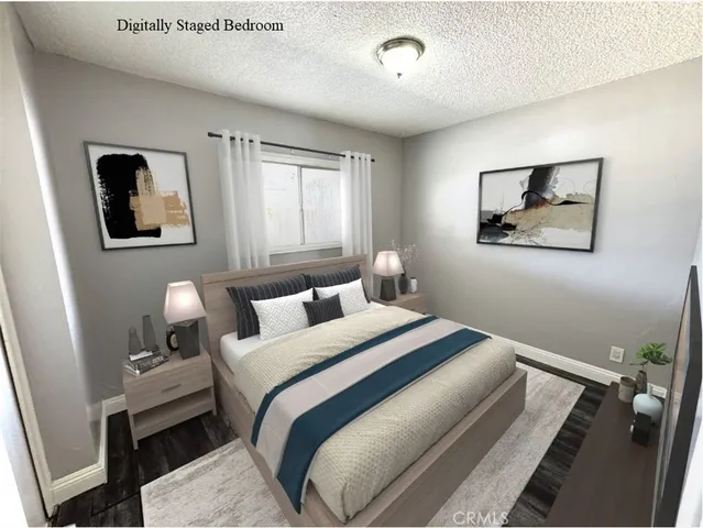 a bedroom with a bed and a painting on the wall