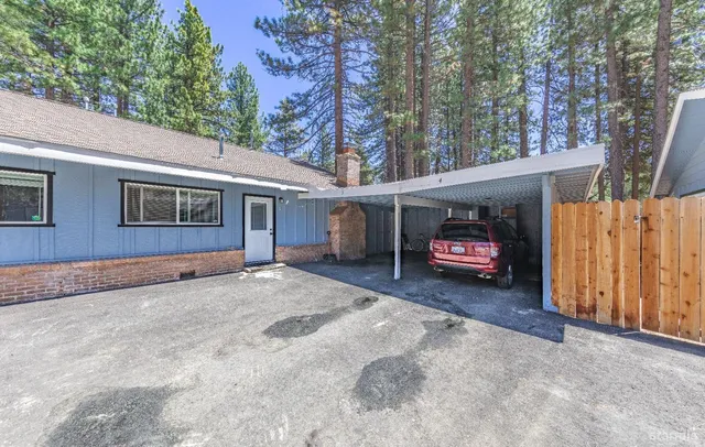 a view of a house with a yard and garage