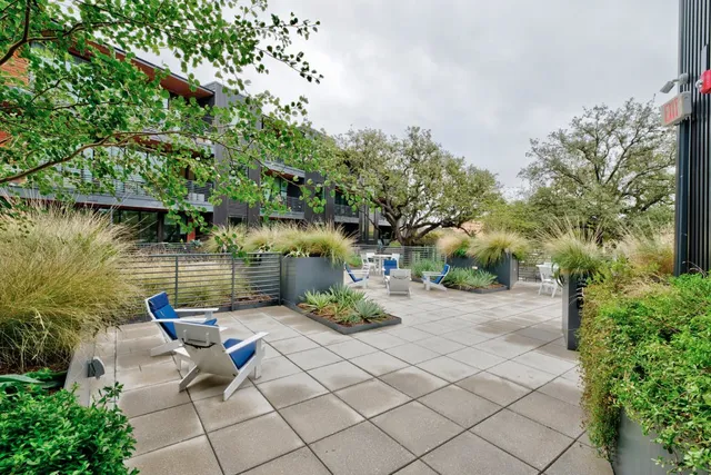 a backyard of a house with seating space