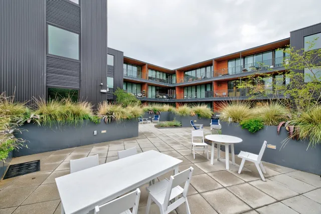 a view of a chairs and table in a patio