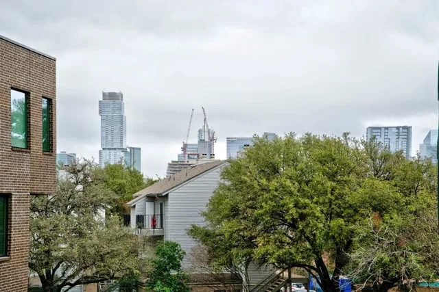a view of a city with tall buildings in the background
