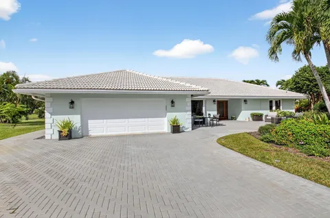 a front view of a house with outdoor seating