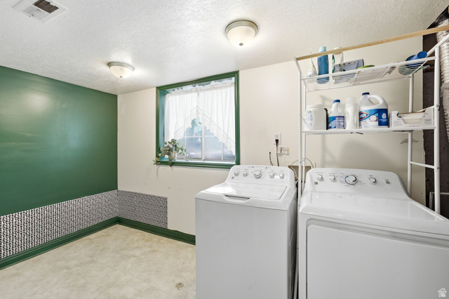 2475 Church Street Layton, UT 84040 - Photo 12 of 27 Dedicated laundry area featuring a window with green trim, mosaic tile wainscoting, and a neutral flooring surface