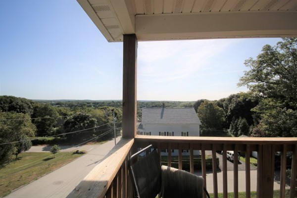 25 George Street, Unit 5 Dudley, MA 01571 - Photo 1 of 42 a view of a balcony with yard