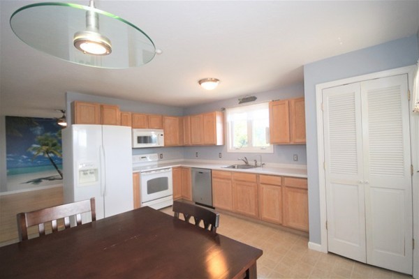 25 George Street, Unit 5 Dudley, MA 01571 - Photo 13 of 42 a kitchen with a sink cabinets and window
