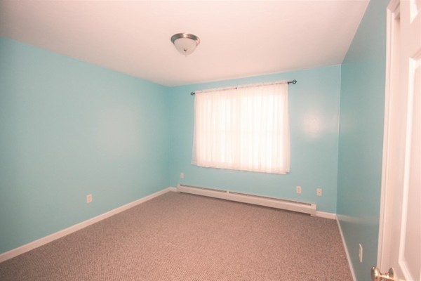 25 George Street, Unit 5 Dudley, MA 01571 - Photo 14 of 42 an empty room with a window