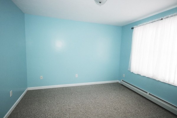 25 George Street, Unit 5 Dudley, MA 01571 - Photo 15 of 42 an empty room with a window