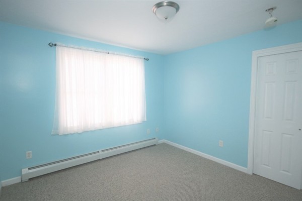 25 George Street, Unit 5 Dudley, MA 01571 - Photo 17 of 42 an empty room with a window