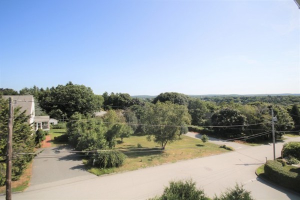 25 George Street, Unit 5 Dudley, MA 01571 - Photo 2 of 42 a view of a lake with a mountain