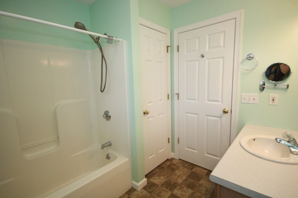 25 George Street, Unit 5 Dudley, MA 01571 - Photo 28 of 42 a bathroom with a sink and a shower