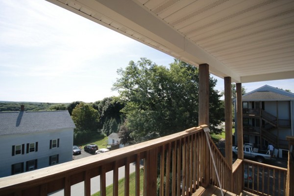 25 George Street, Unit 5 Dudley, MA 01571 - Photo 30 of 42 a view of a balcony with yard