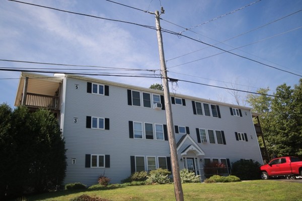 25 George Street, Unit 5 Dudley, MA 01571 - Photo 37 of 42 a front view of a building with yard
