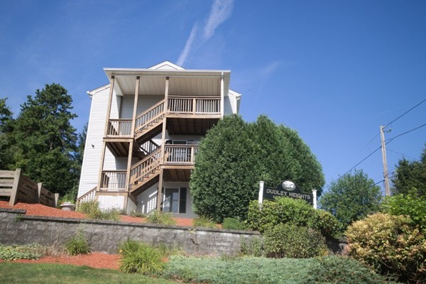 25 George Street, Unit 5 Dudley, MA 01571 - Photo 40 of 42 a front view of a house with a yard
