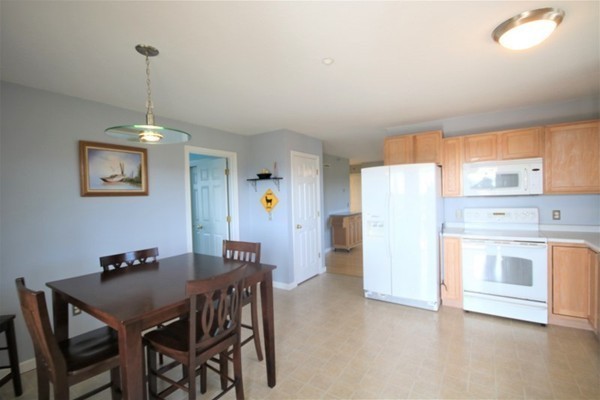 25 George Street, Unit 5 Dudley, MA 01571 - Photo 6 of 42 a view of a dining room with furniture window and wooden floor