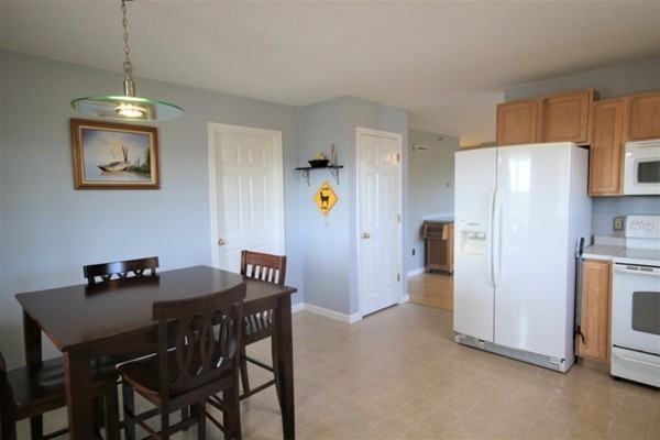 25 George Street, Unit 5 Dudley, MA 01571 - Photo 9 of 42 a view of a dining room with furniture and a refrigerator