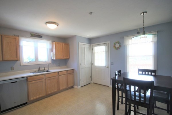25 George Street, Unit 5 Dudley, MA 01571 - Photo 10 of 42 a view of a kitchen and a dining room