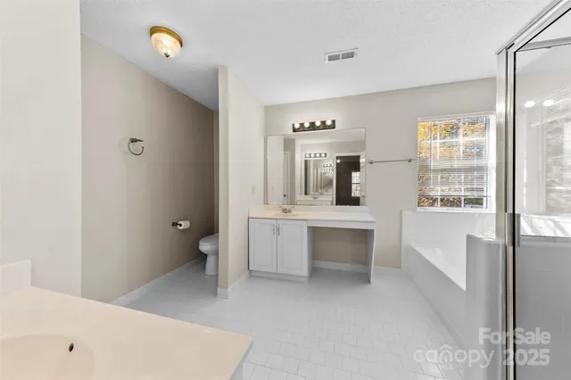 a room with a bed and a window