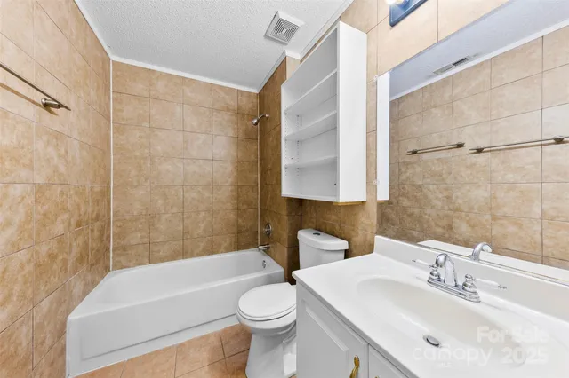 a bathroom with a sink a toilet and bathtub