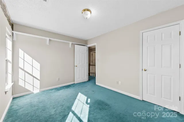 a view of room with window and hardwood floor
