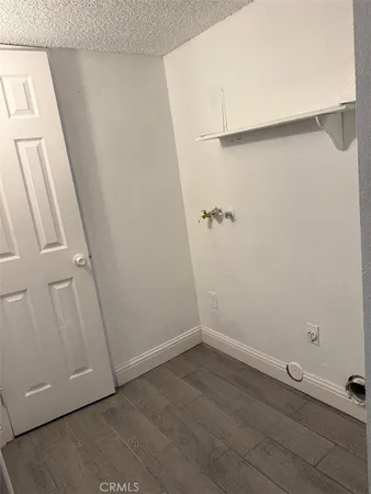 an empty room with a wooden door