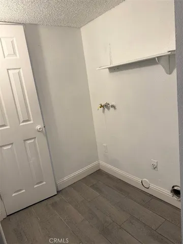 an empty room with a wooden door