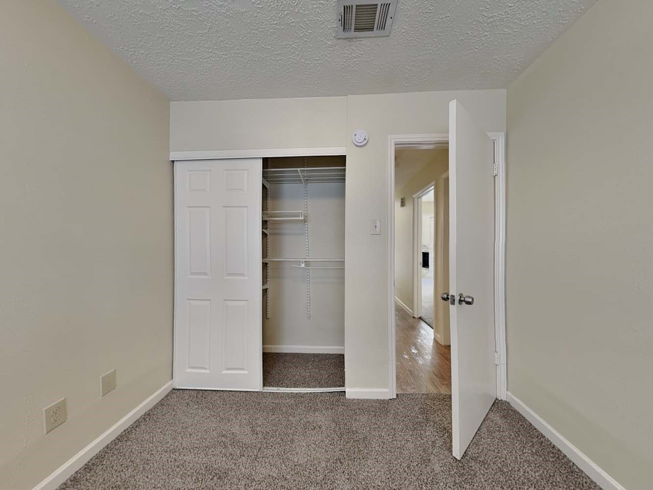 9203 Rippling Fields Drive Houston, TX 77064 - Photo 12 of 16 an empty room with closet