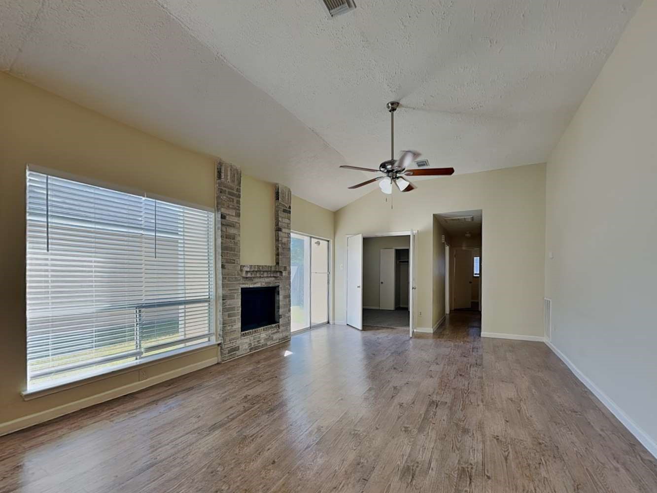 9203 Rippling Fields Drive Houston, TX 77064 - Photo 4 of 16 wooden floor in an empty room with a window