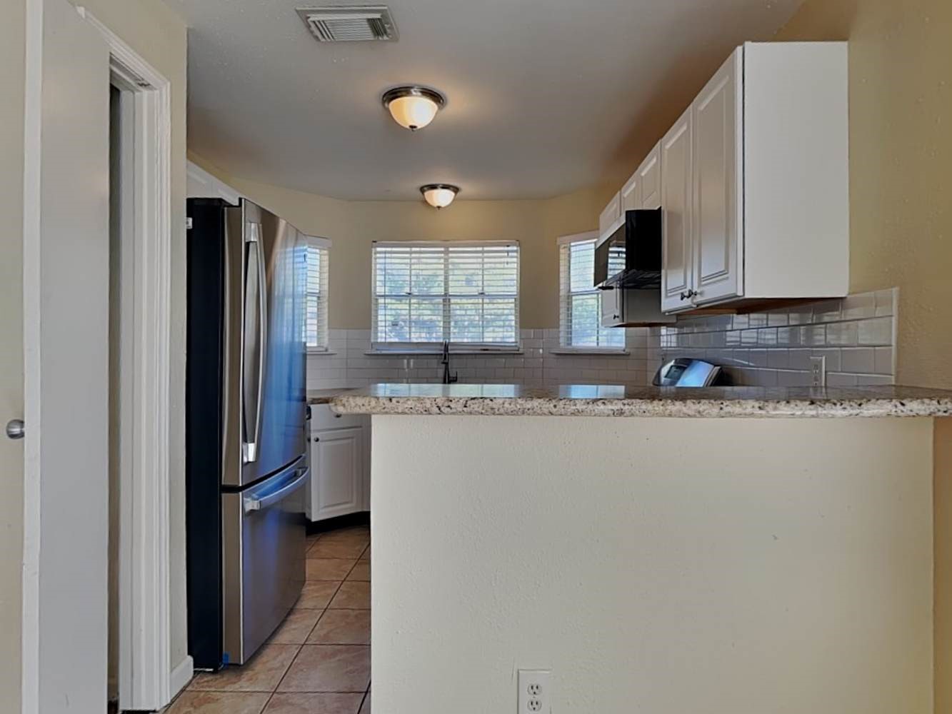 9203 Rippling Fields Drive Houston, TX 77064 - Photo 6 of 16 a kitchen with stainless steel appliances granite countertop a refrigerator and a sink