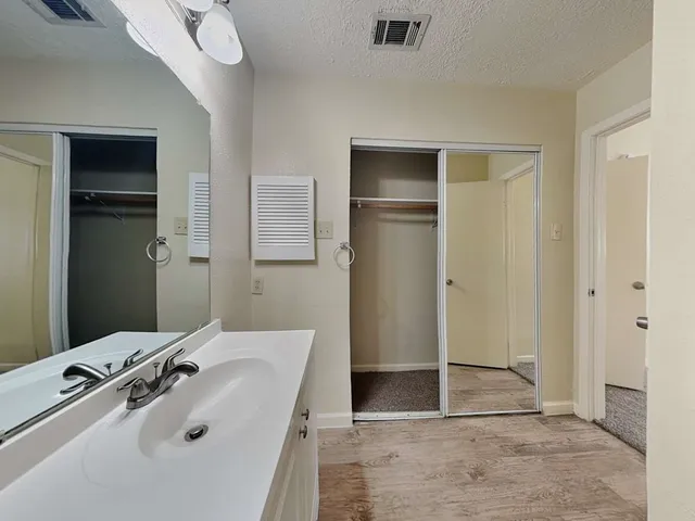 a bathroom with a sink and shower