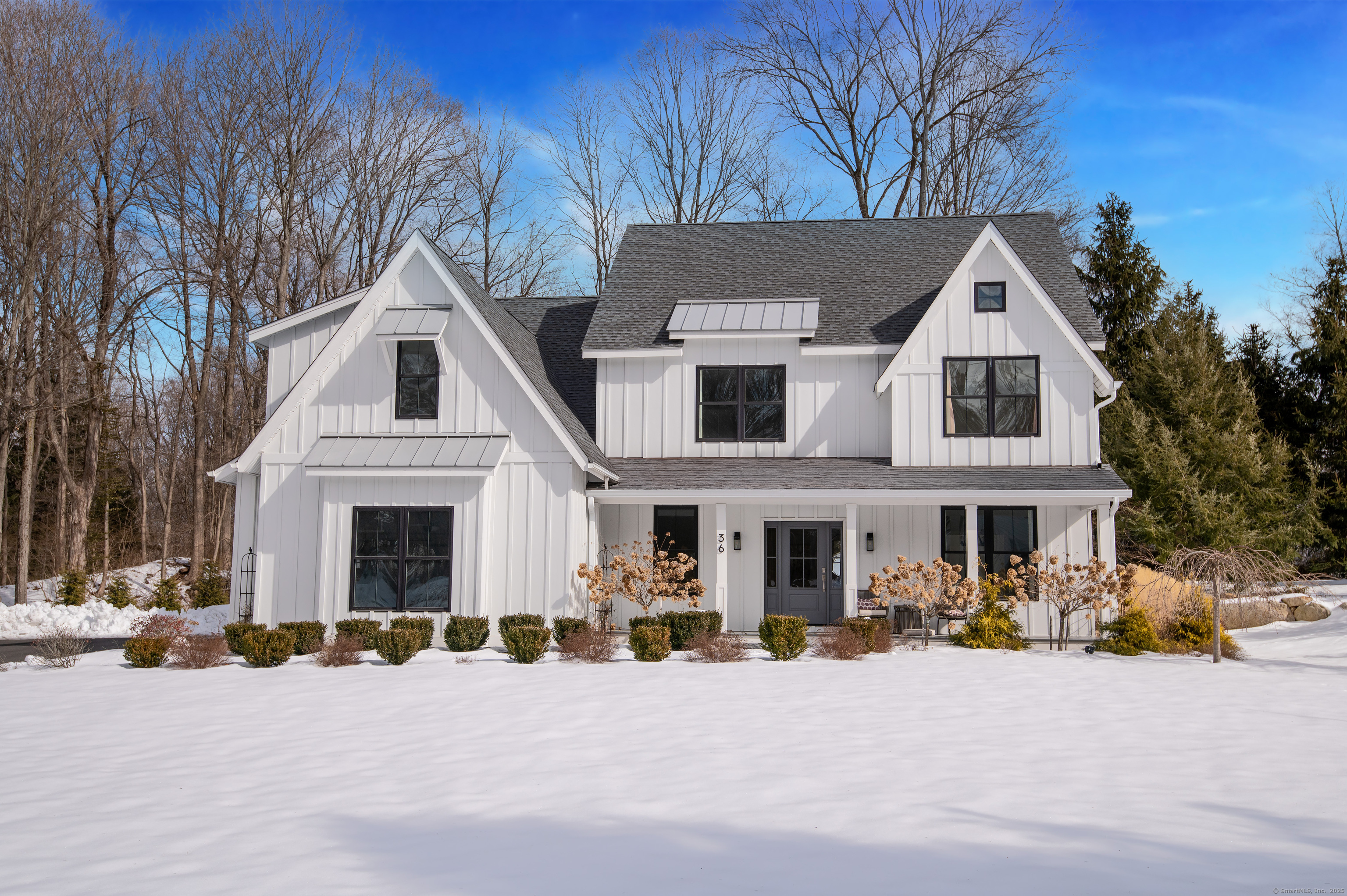36 Ramapoo Road Ridgefield, CT 06877 - Photo 1 of 1 a front view of a house with a yard