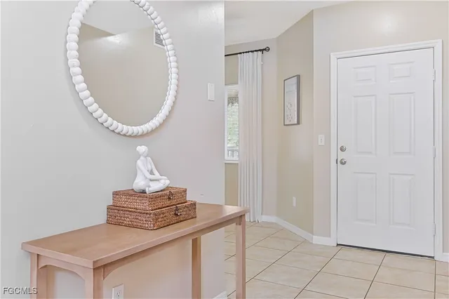 a view of a livingroom with washer and mirror