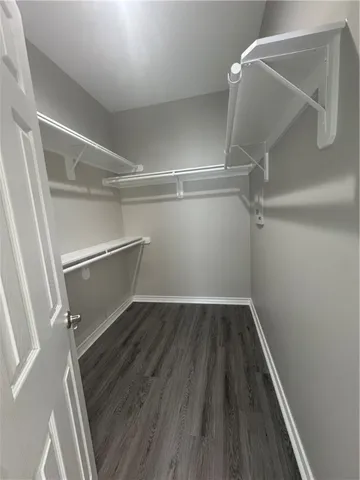 a view of an empty walk in closet
