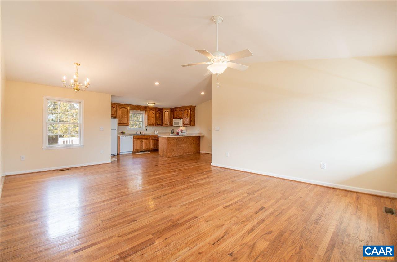 761 West Daffodil Road Ruckersville, VA 22968 - Photo 8 of 39 a view of a kitchen with a dishwasher cabinets and wooden floor