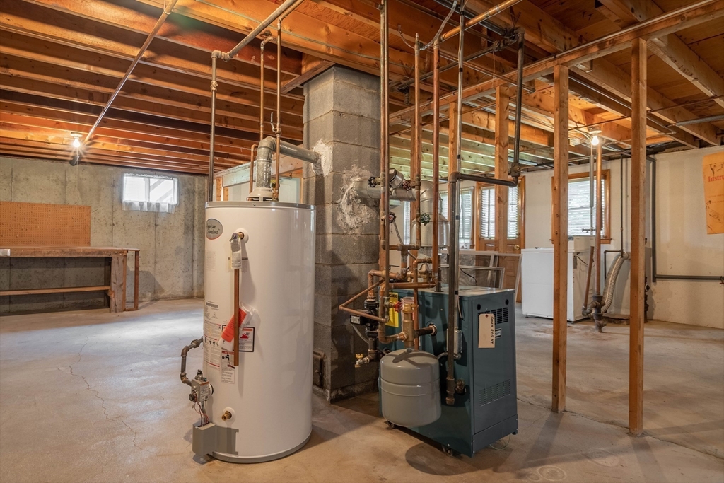 58 Wedgewood Road Worcester, MA 01602 - Photo 26 of 28 a view of a refrigerator with wooden floor