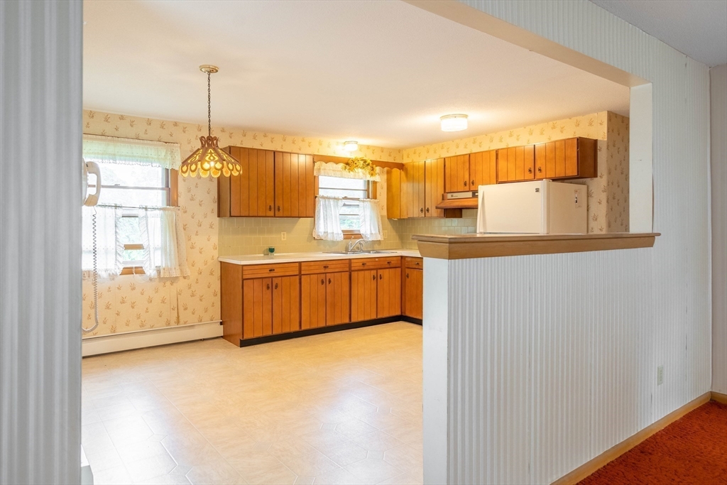 58 Wedgewood Road Worcester, MA 01602 - Photo 8 of 28 a kitchen with stainless steel appliances a sink and a window
