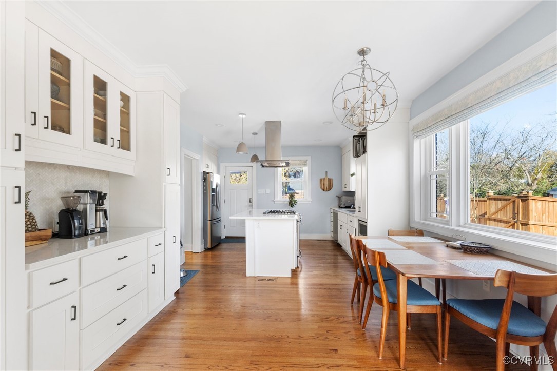 4100 Patterson Avenue Richmond, VA 23221 - Photo 11 of 37 a view of a dining room with furniture large window and wooden floor