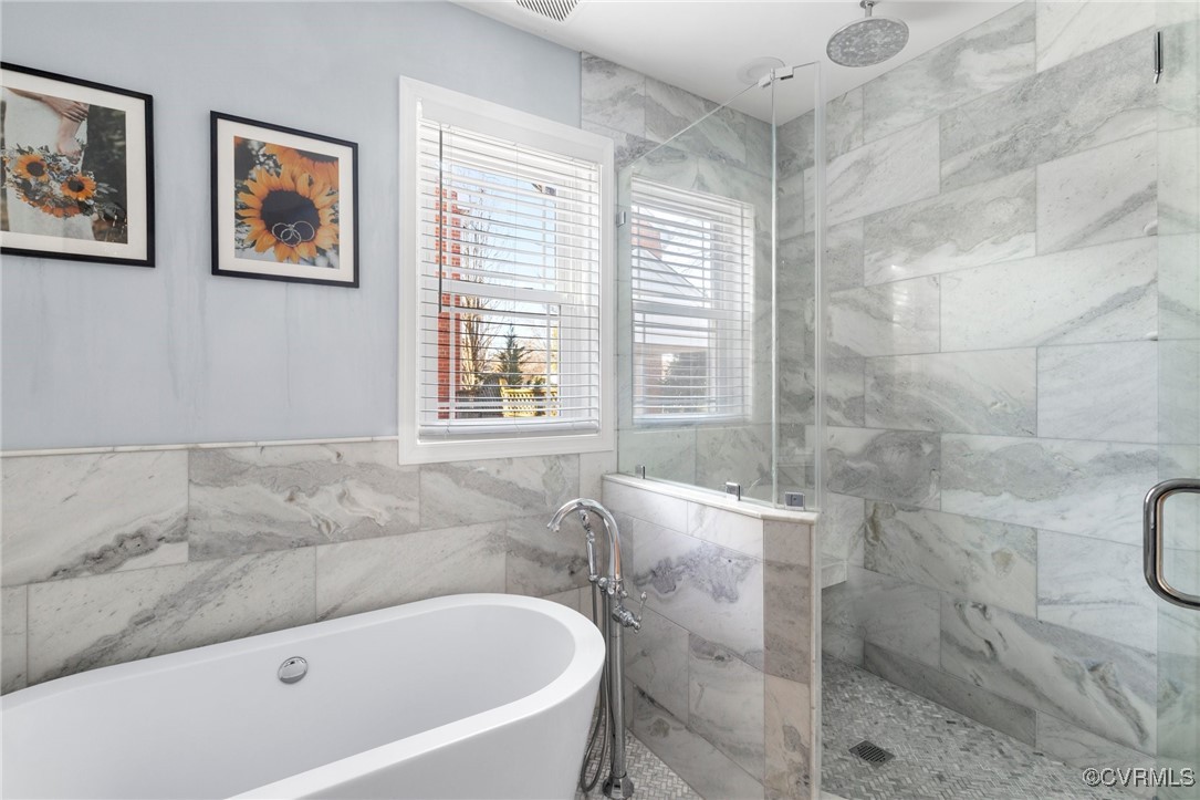 4100 Patterson Avenue Richmond, VA 23221 - Photo 22 of 37 a bath tub sitting in a bathroom next to a window