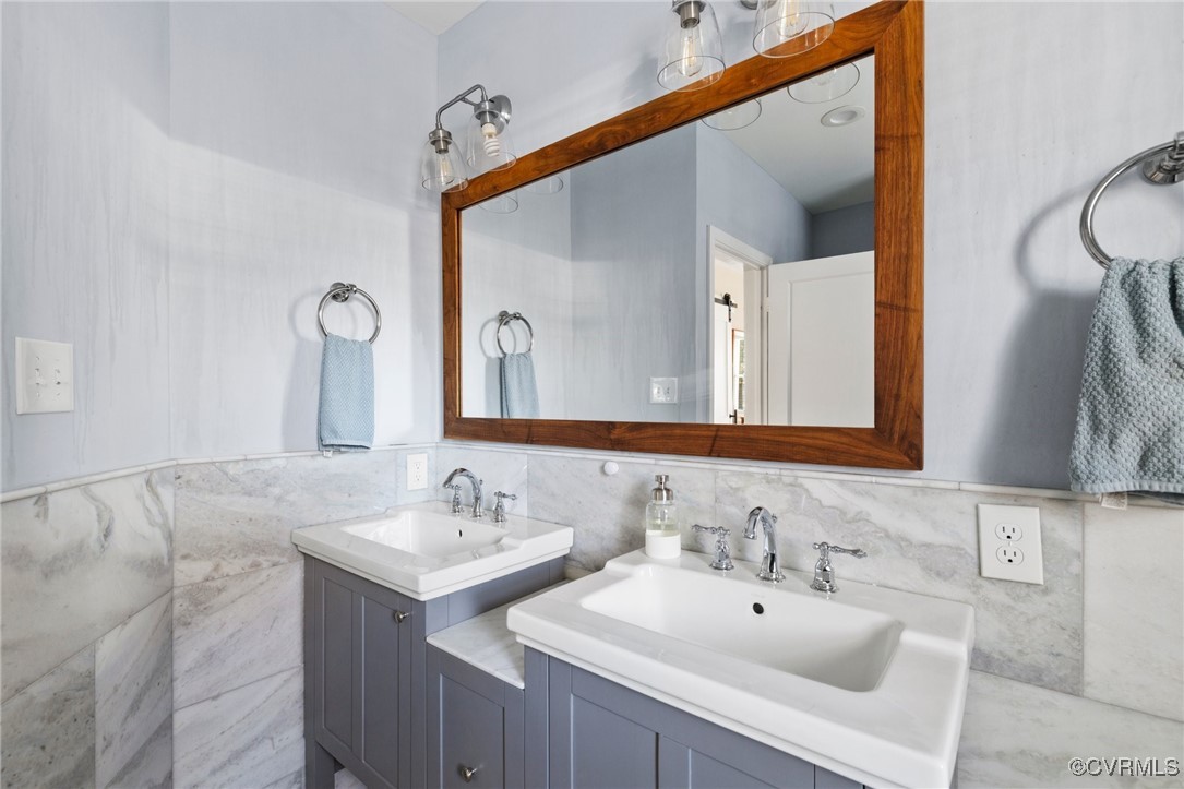 4100 Patterson Avenue Richmond, VA 23221 - Photo 23 of 37 a bathroom with a sink and a mirror