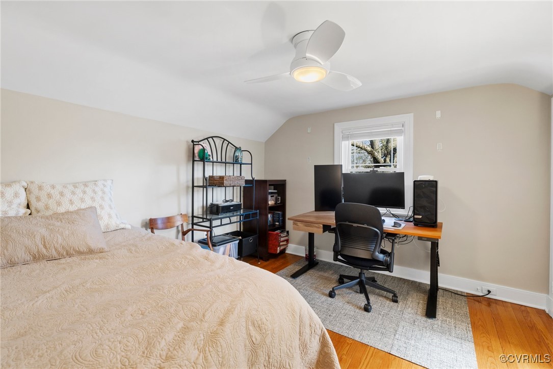 4100 Patterson Avenue Richmond, VA 23221 - Photo 25 of 37 a bedroom with a bed a desk and chair
