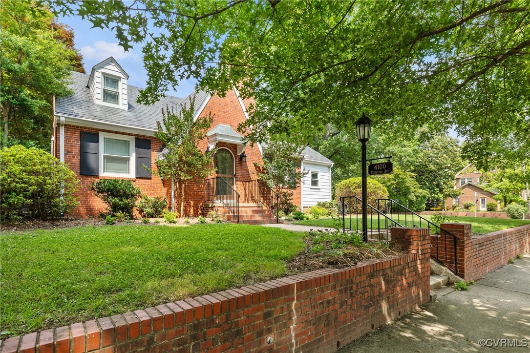 4100 Patterson Avenue Richmond, VA 23221 - Photo 3 of 37 a front view of a house with a yard and potted plants