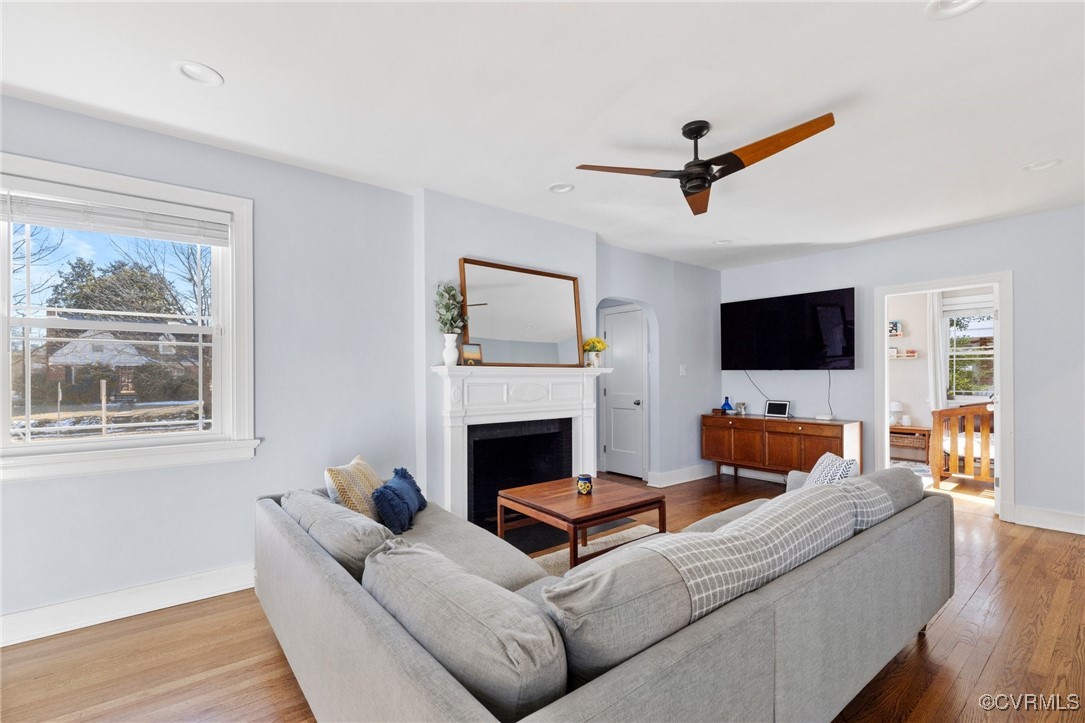 4100 Patterson Avenue Richmond, VA 23221 - Photo 9 of 37 a living room with furniture a fireplace and a flat screen tv