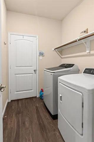 a view of storage and utility room with washer and dryer