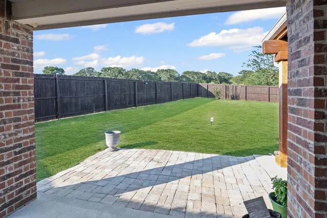 a view of a backyard with a garden