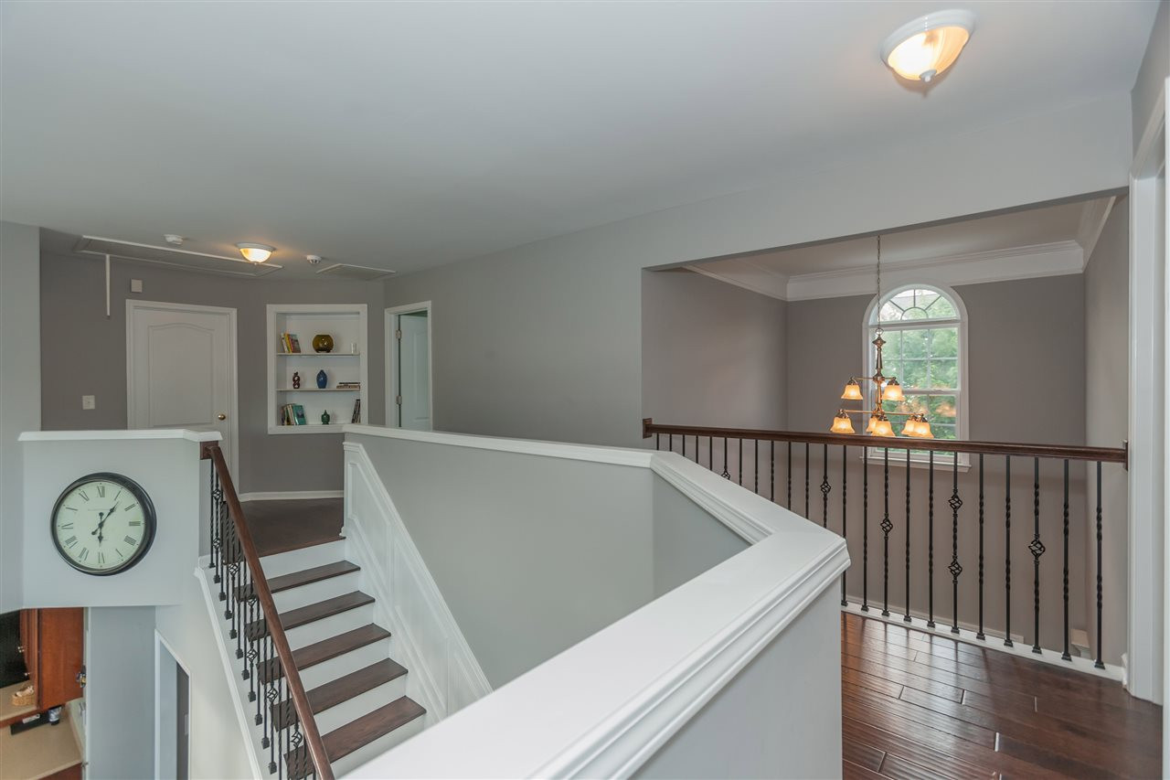 7613 Silver View Lane Raleigh, NC 27613 - Photo 12 of 25 The rich designer floors continue into the upstairs hallway. Upstairs Hallway