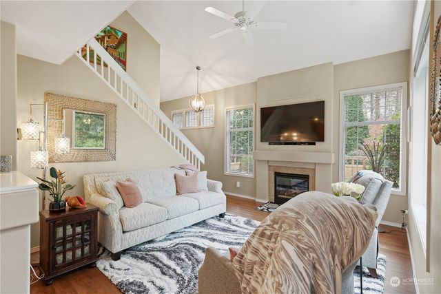 a living room with furniture fireplace and a flat screen tv