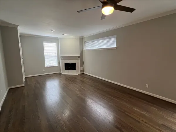 a bedroom with a bed and a ceiling fan